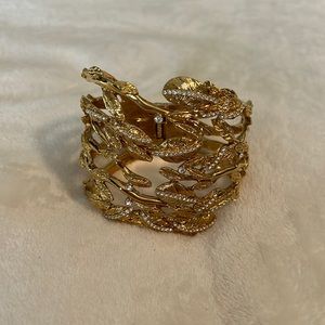 Gold tone and CZ style hinged cuff bracelet